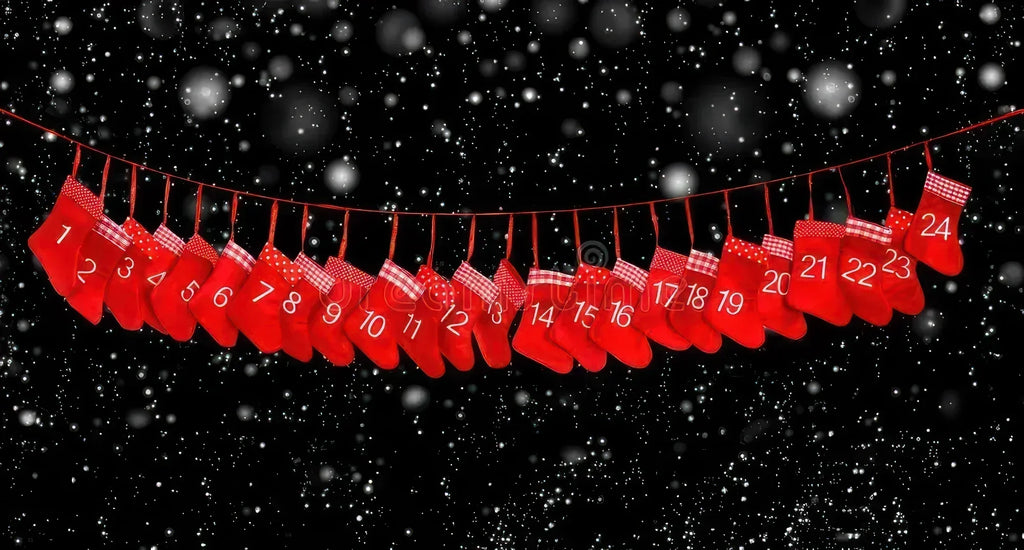 Christmas advent calendar with numbered socks hanging on a line with stary, snowy night sky background